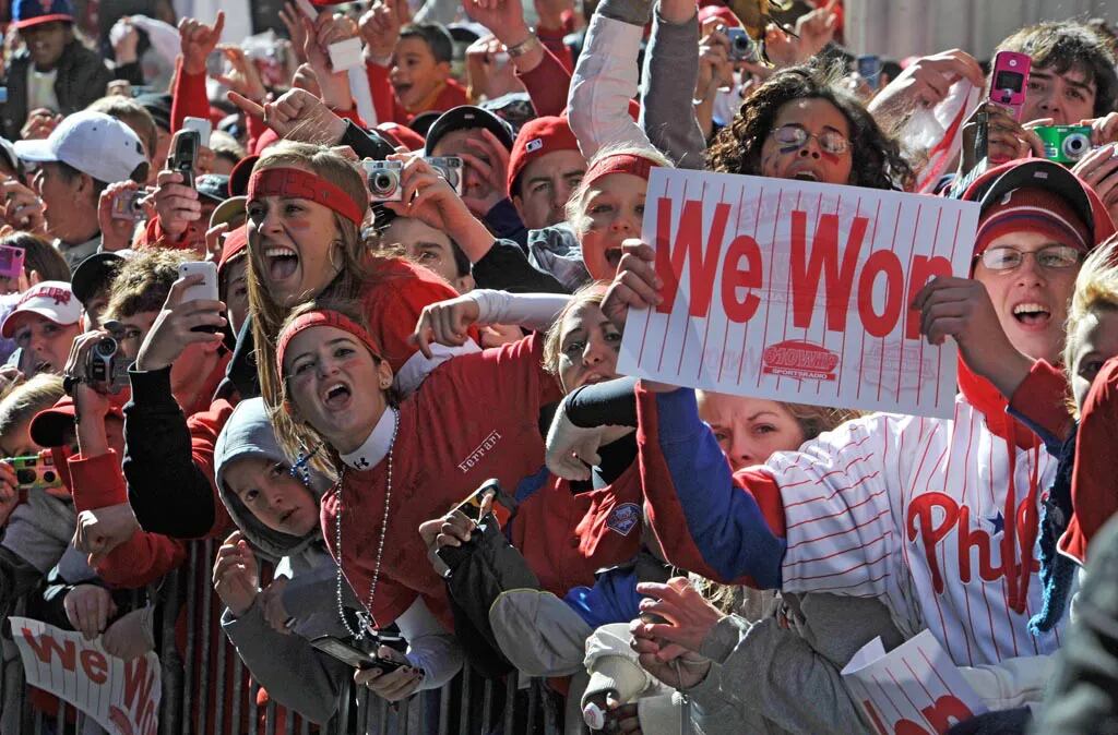 Philadelphia Phillies fans celebrating Phillies World Series victory  October 31, 2008 with parade down Broad Street Philadelphia, PA - SuperStock