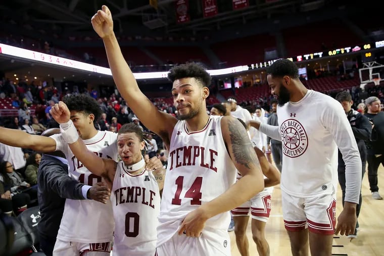 Temple forwards Jake Forrester (10), J.P. Moorman II (4), and Arashma Parks (14) celebrate after a game against Rider at the Liacouras Center in North Philadelphia on Saturday, Dec. 21, 2019. Temple won 78-66.