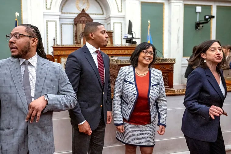 The four new members of Philadelphia City Council, from left, Jeffery Young, Jr., Nicolas O’Rourke, Nina Ahmad, and Rue Landau gather after their first Council meeting at City Hall in January.