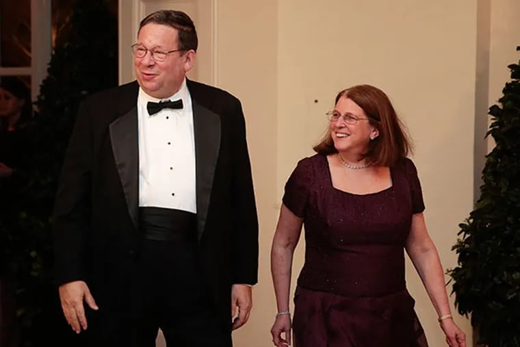 David Cohen, chairman of the University of Pennsylvania and former executive vice president of Comcast Corp., left, and his wife Rhonda Cohen arrive at a state dinner hosted by U.S. President Barack Obama and U.S. First Lady Michelle Obama in honor of French President Francois Hollande at the White House in Washington, D.C., U.S., on Tuesday, Feb. 11, 2014.  (Andrew Harrer/Bloomberg)