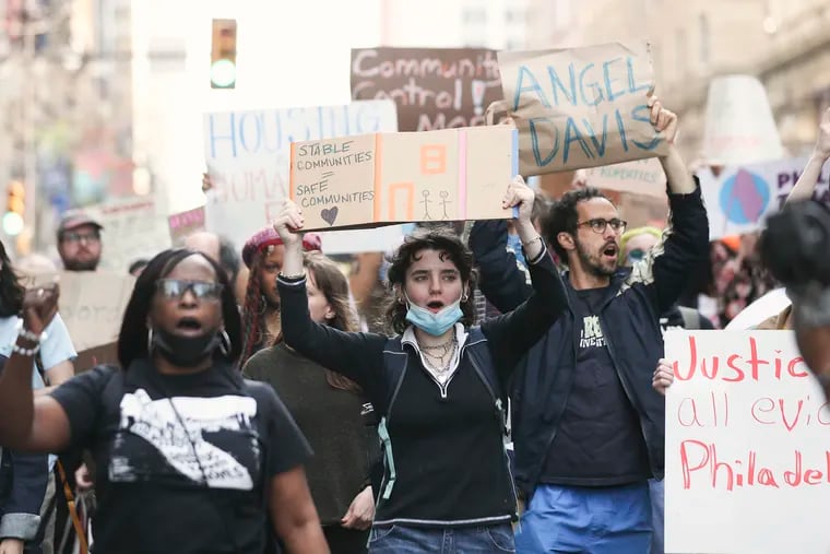 Housing advocates march down Broad Street after holding a rally outside of the landlord-tenant office after a deputy shot Angel Davis during an eviction in Philadelphia in 2023.