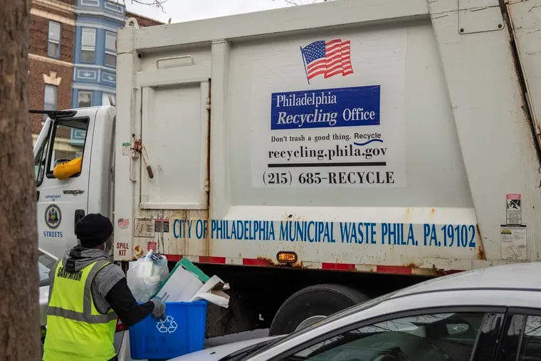 FILE - Recycling is collected on the 4300 block of Walnut in West Philadelphia on Wednesday, Jan. 23, 2019.