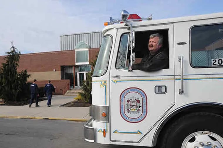 J.C. &quot;Sarge&quot; Bohleman picks up a fire truck he bought from Montco. His company supplies vehicles to movie sets.