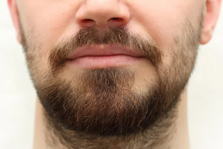 Many people have been growing a pandemic beard; but some are wondering if it's safer to shave it. (Dreamstime/TNS)