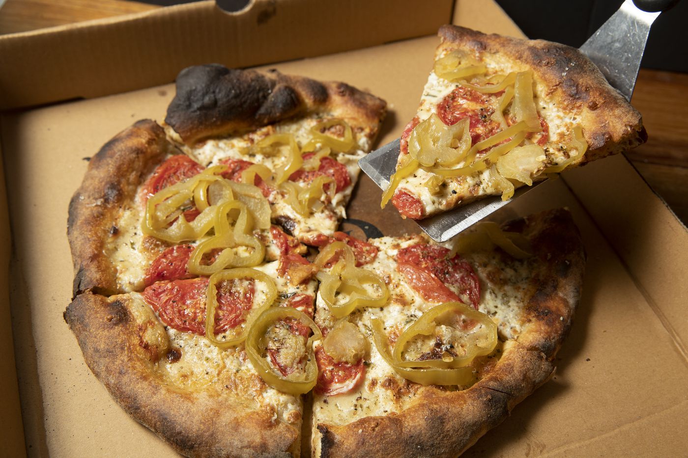 The pizzazz pizza from Sally’s is homage to the South Philadelphia pie of the same name from Celebre's.