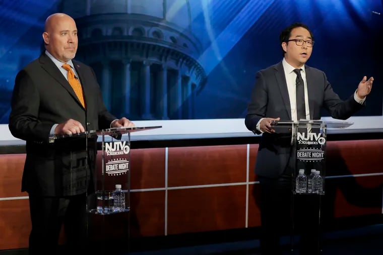 Andy Kim, right, the Democratic candidate in the U.S. Congressional District 3 race, speaks during a debate with Republican candidate Tom MacArthur on Wednesday in Newark.