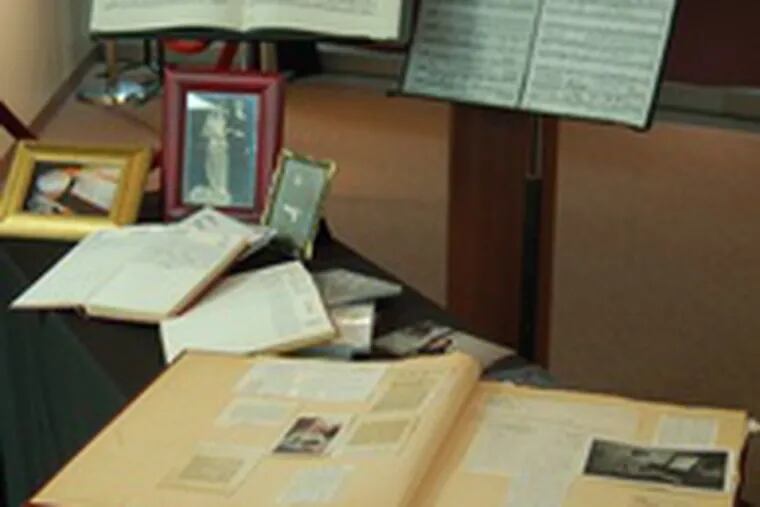 Harry Hewitt’s scrapbook, journals, family photos and music penned by him are on display at Philadelphia Biblical University, Langhorne. “Just because he’d written something didn’t mean it needed to be performed,” his wife says.