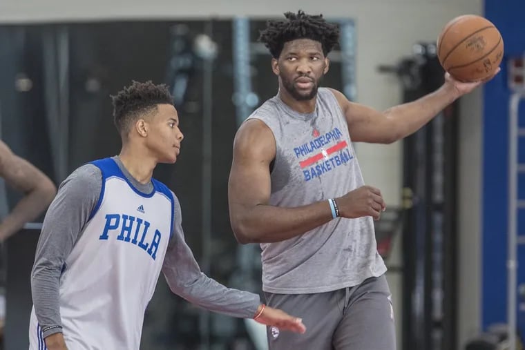 Joel Embiid playing keep-away from first-round draft pick Markele Fultz during rookie camp.