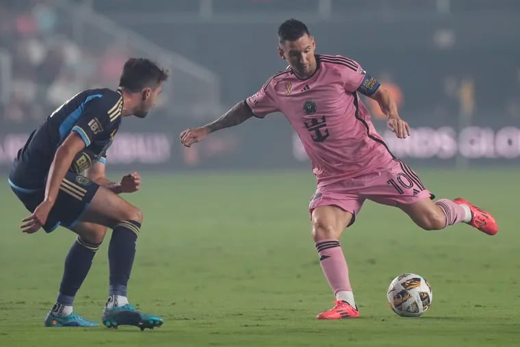 Inter Miami superstar Lionel Messi (right) on the ball in front of the Union's Leon Flach during the first half.