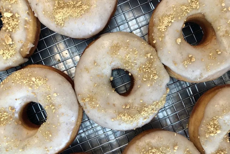 Doughnuts in a case at Hello Donuts & Coffee. Among the changing list of flavors are chocolate chip cake, cinnamon toast, and peanut butter banana.