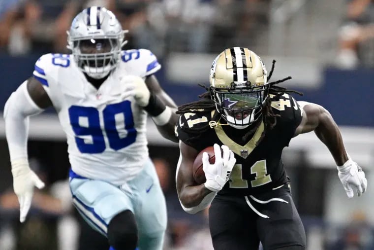 New Orleans running back Alvin Kamara breaks away with Dallas Cowboys defensive end DeMarcus Lawrence in pursuit during the Saints' easy win.