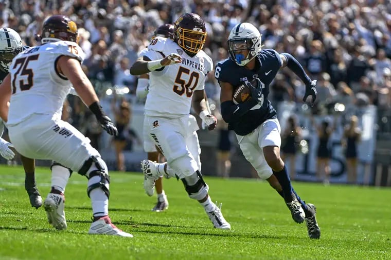 Penn State safety Zakee Wheatley (6) returns an interception as Central Michigan offensive lineman Jamezz Kimbrough (50) chases during the Nittany Lions' 33-14 win over the Chippewas.