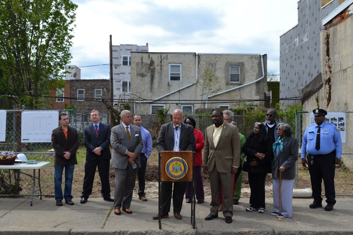 Jeffrey Allegretti stands at the podium during the 2015 groundbreaking for his South Point affordable housing development in Point Breeze. Councilman Kenyatta Johnson is on his left.