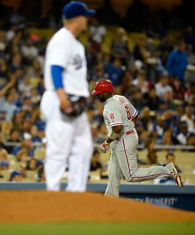 Photo: Philadelphia Phillies starting pitcher Cliff Lee hugs Carlos Ruiz  after the game against the New York Yankees in game 1 of the World Series  at Yankee Stadium in New York 