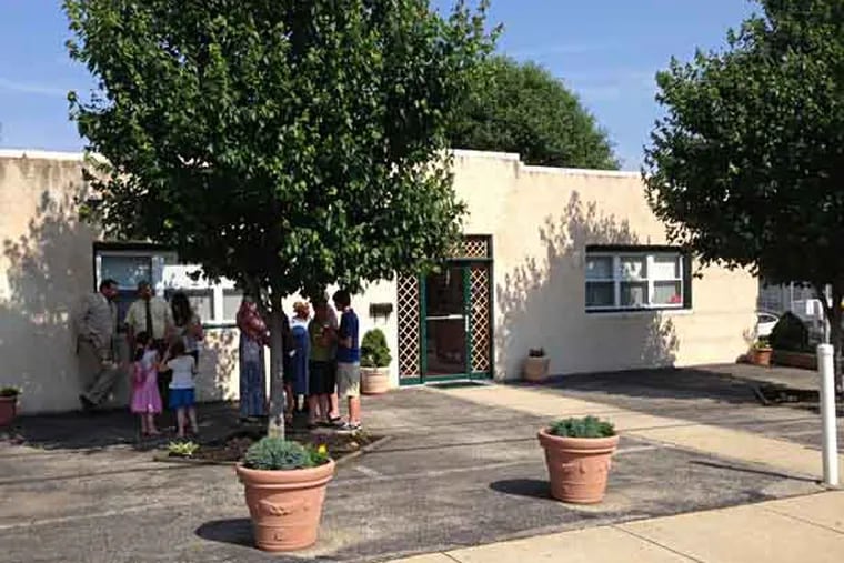 Members gather outside First Century Gospel Church on Sunday, June 9 / SOLOMON LEAH / DAILY NEWS STAFF