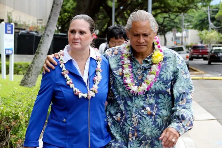 FILE - In this Oct. 20, 2017 file photo, former Honolulu Police Chief Louis Kealoha and his wife Katherine Keahola leave federal court in Honolulu. Kealoha was Honolulu's Rolex-wearing police chief and his wife Katherine was the Maserati-driving prosecutor in charge of a unit targeting career criminals. Prosecutors say the couple funded a lavish lifestyle by defrauding banks, relatives and children. They're heading to trial in May 2019 on charges they orchestrated the framing of a relative for a mailbox theft who threatened to expose their fraud.  (AP Photo/Caleb Jones, File)