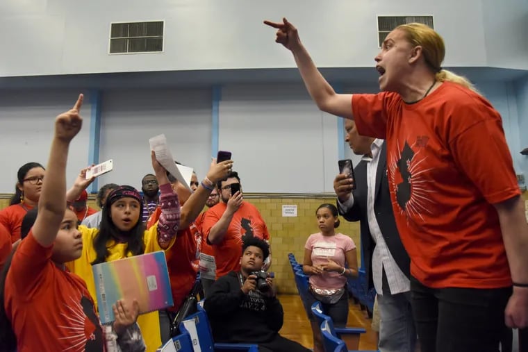 Activist Dava Salas leads a demonstration that shut down a Camden school board meeting in April 2019, during threatened public school closures.