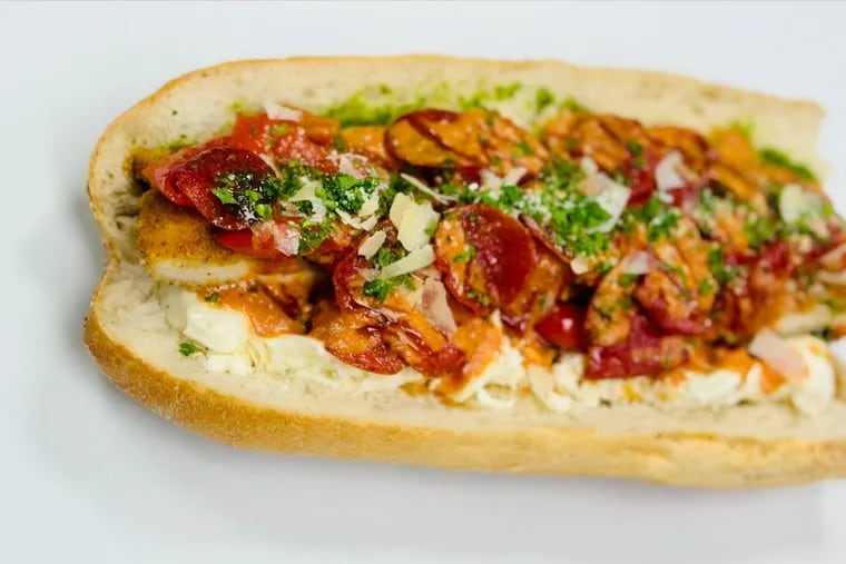 "The Vincent," a chicken cutlet, fried pepperoni, and vodka sauce sandwich on a seeded roll, available at America's Pie Kitchen and Grille in Section 114 at Lincoln Financial Field in South Philadelphia.