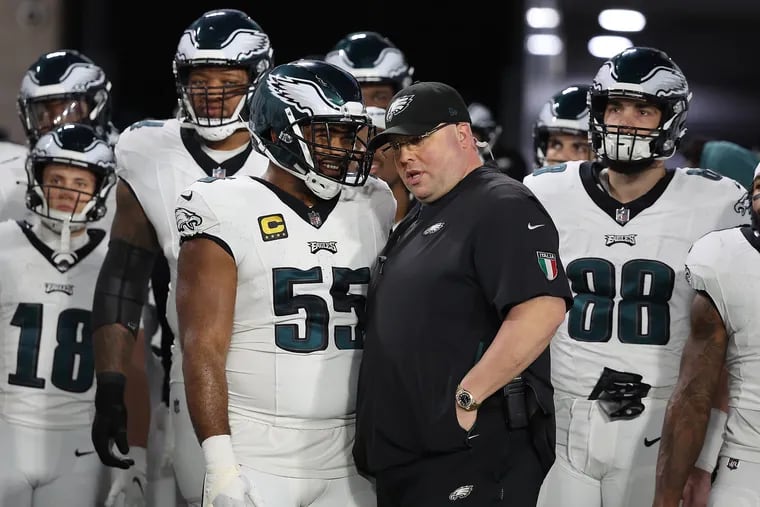 Eagles chief security officer Dom DiSandro (right) as the team waits for introductions before the start of their Jan. 15 playoff game against the Buccaneers.