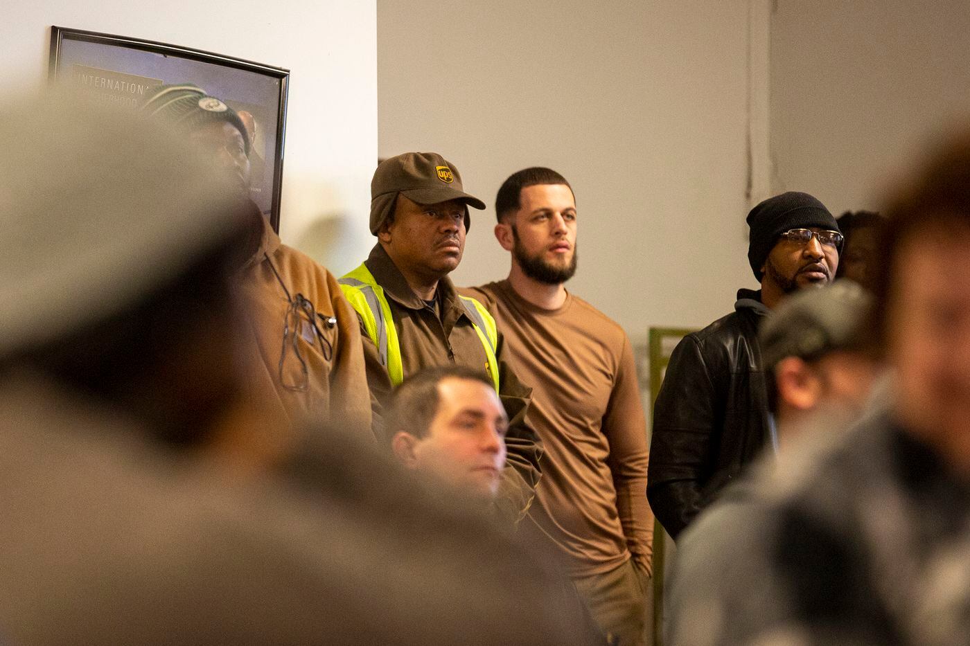 UPS drivers Juan Bowen (left) and Nicholas Ruggiero attend Saturday's meeting.