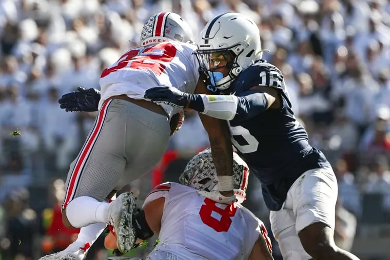 Penn State safety Ji'Ayir Brown (16) tackles Ohio State running back TreVeyon Henderson during last year's clash between the two teams. This year, No. 7 Penn State will be looking to avenge a 44-31 defeat.