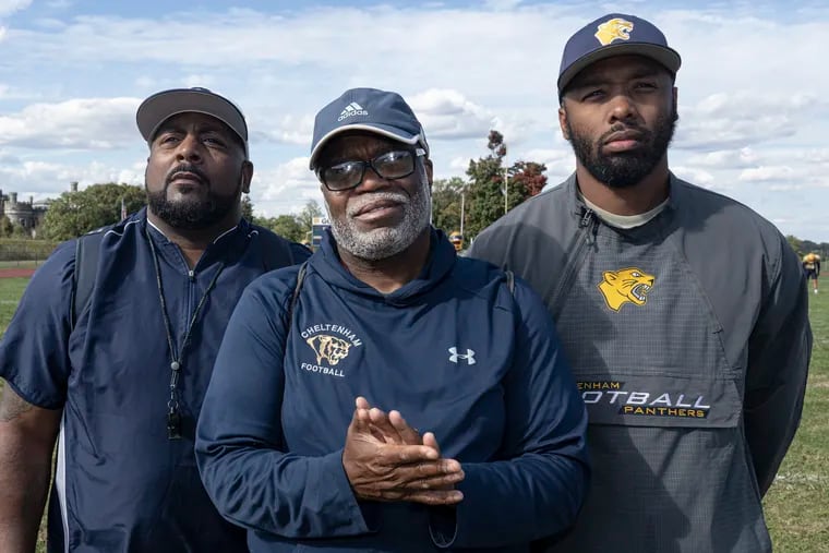 Cheltenham High football coach Troy Gore (center) with assistant coaches Kevin Hite,(left) and D.J. McFadden during practice on Oct. 8.