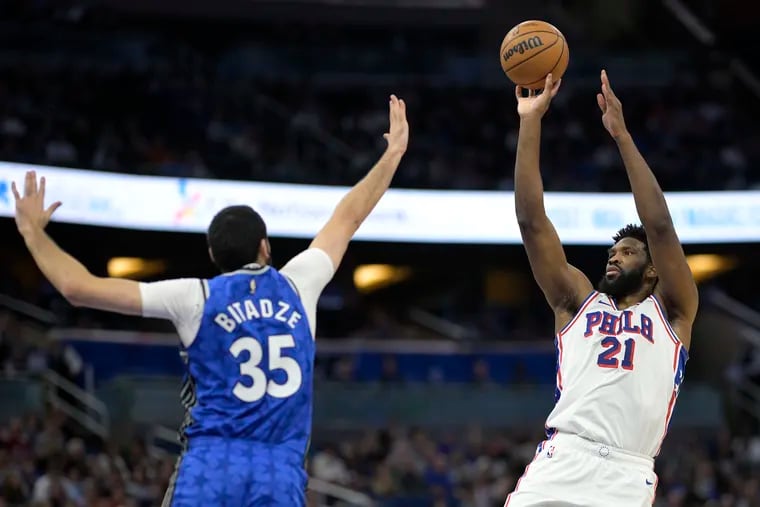 Philadelphia 76ers center Joel Embiid (21) shoots in front of Orlando Magic center Goga Bitadze (35) during the first half of Friday night's win.