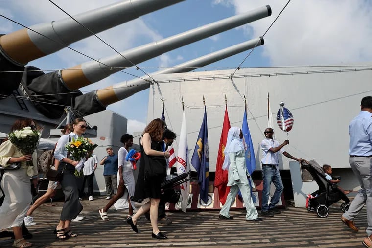 Participants and supporters arrive for the Independence Day Naturalization Ceremony on Battleship New Jersey in Camden. The U.S. Citizenship and Immigration Services welcomed 42 new U.S. citizens — including nine U.S. military service members from the Army, Air Force, Navy, and Coast Guard during the naturalization ceremony.