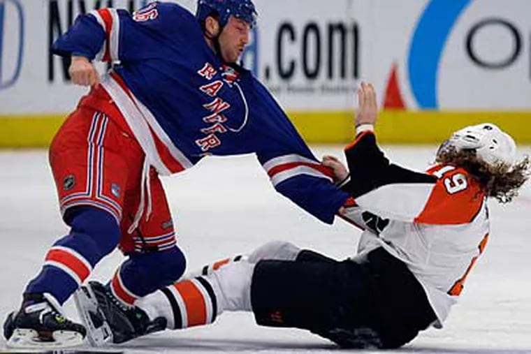 Rangers' Sean Avery fights with Scott Hartnell during the first period.  The Flyers got their revenge to the tune of a 6-0 victory. (AP Photo/Julie Jacobson)