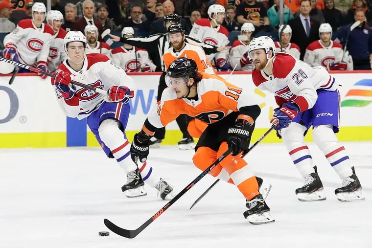 Flyers right winger Travis Konecny skates past Montreal Canadiens defensemen Jeff Petry (right) and Cale Fleury in a regular-season game Nov. 7. The Flyers went 2-1 against the Habs, the team they will meet in the first round of the Stanley Cup playoffs starting Wednesday.