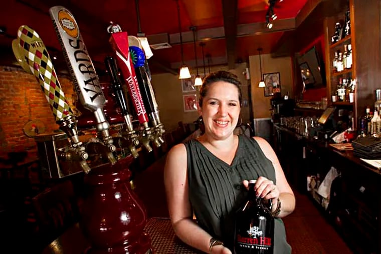 Erin Wallace, owner of Devil's Den in S. Philadelphia, Barren Hill Tavern & Brewery in Lafayette Hill, PA and Old Eagle Tavern in Manayunk, behind bar at Devil's Den 1148 S. 11th St. on Monday morning June 23, 2014. ( ALEJANDRO A. ALVAREZ / STAFF PHOTOGRAPHER )