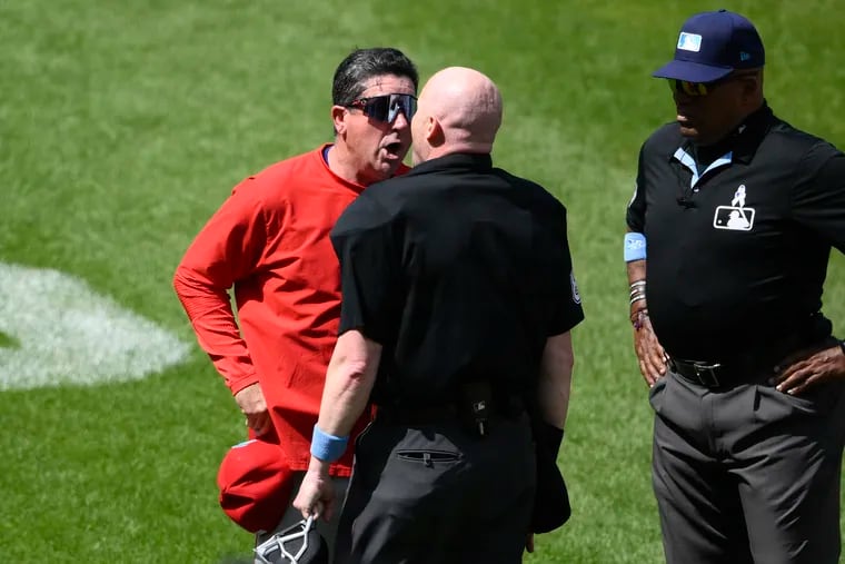 Phillies manager Rob Thomson argues with home plate umpire Mike Estabrook after he was ejected from the game in the sixth inning.