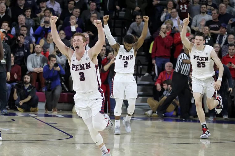 From left, Jake Silpe, Antonio Woods, and AJ Brodeur of Penn celebrating after their 78-75 victory over Villanova at the Palestra on Dec. 11.