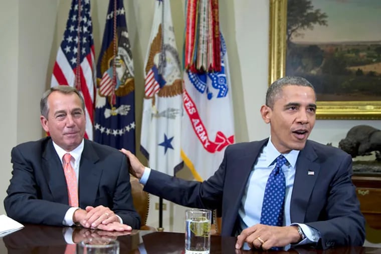 In this file photo, President Barack Obama acknowledges House Speaker John Boehner of Ohio while speaking to reporters in the Roosevelt Room of the White House in Washington. (AP Photo/Pablo Martinez Monsivais)