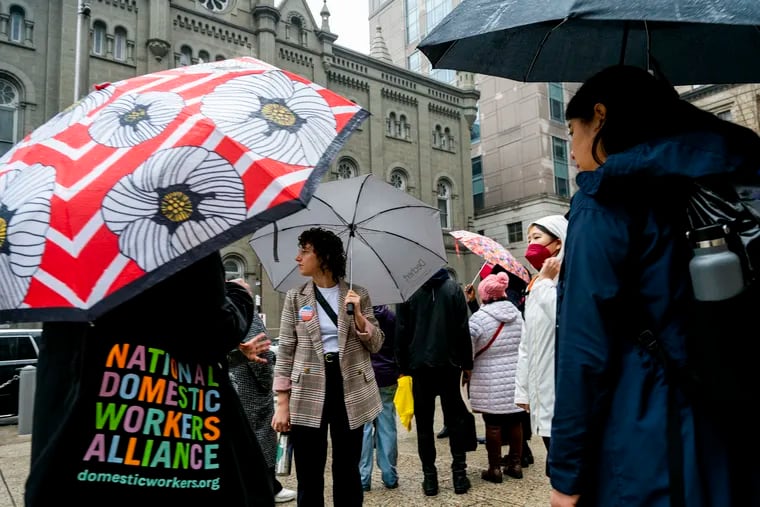 Domestic workers gather outside City Hall on Jan. 25, 2024, before heading into City Council to ask members for their support. Arnetta Anderson, a domestic worker and caregiver in Philadelphia, argues that Mayor Cherelle L. Parker can do more to help domestic workers in the city.