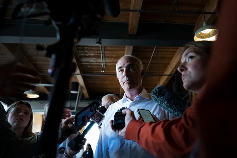 Sen. Bob Casey speaks to reporters Monday after a rally in Scranton, Pa.