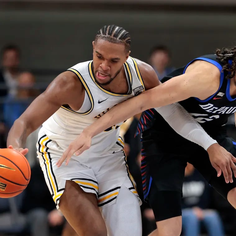 Mac Etienne (right) seen here battling with Villanova's Eric Dixon last season, will do so again as a member of La Salle’s squad this season.