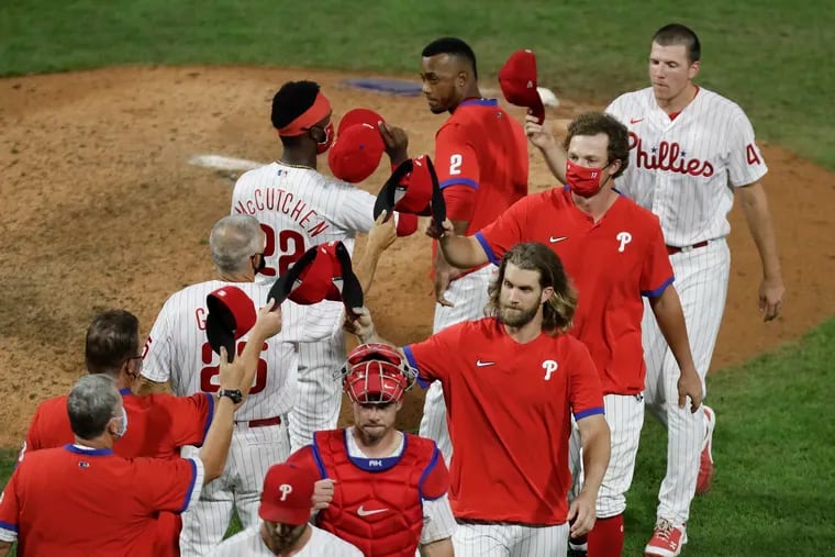 The Phillies celebrate their 13-8 win over the Atlanta Braves on Monday, August 10, 2020 in Philadelphia.