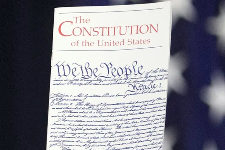 FILE - In this March 23, 2016 photo, the Constitution is held by a member of Congress on Capitol Hill in Washington. President Donald Trump says he wants to order the end of the constitutional right to citizenship for babies of non-citizens and unauthorized immigrants born in the United States.  (AP Photo/J. Scott Applewhite)