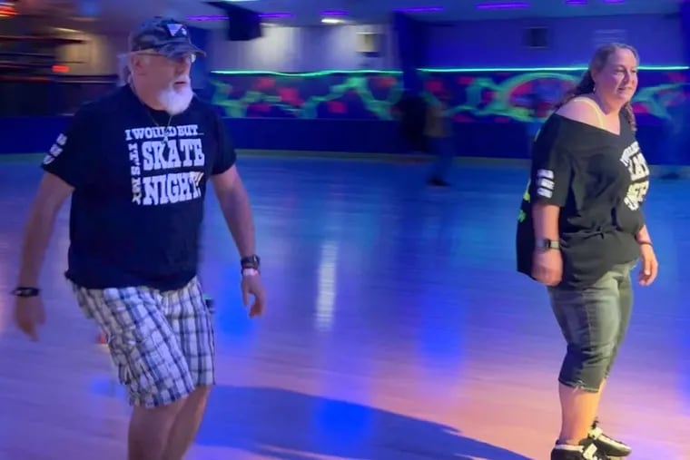 Ray Stitt, a.k.a. Big Daddy Ray (left), roller skates at an adult skate night at Philly Skateplex on July 24, 2024.