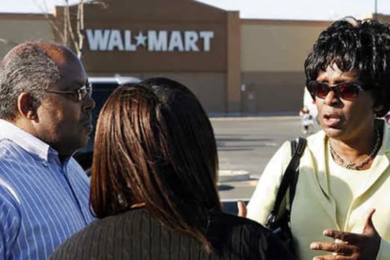 Ronald Tinsley, Shelia Ellington (center), and Tracy Jenkins were at the store when a racist remark was made. (AP)