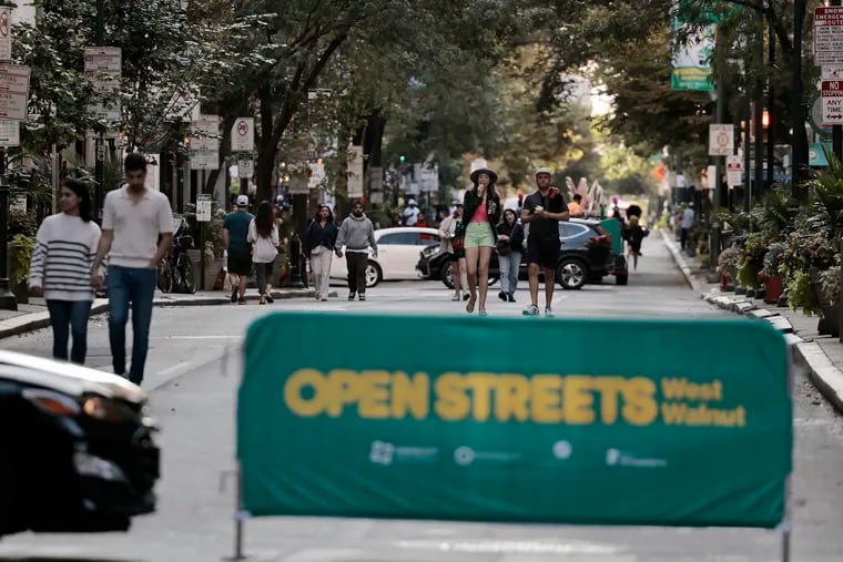 People stroll in the 1600 block of Walnut Street during the Open Streets: West Walnut event in Philadelphia on Sunday, Sept. 8, 2024.