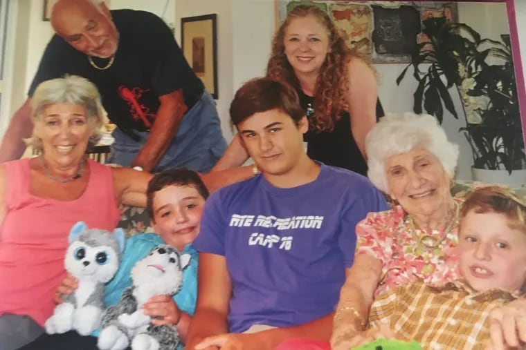 Mrs. Rudin (second from right) with her daughter Marion (left), son-in-law Vincenzo Sanguineti (standing), great-grandson Elijah Rhyne (second from left), step-great-grandson Nicholas Roach, great-grandson Benjamin Rhyne and granddaughter Jillian Frank (standing).