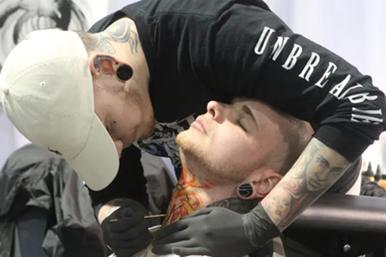 Louis Vuitton tattoo located on the neck.
