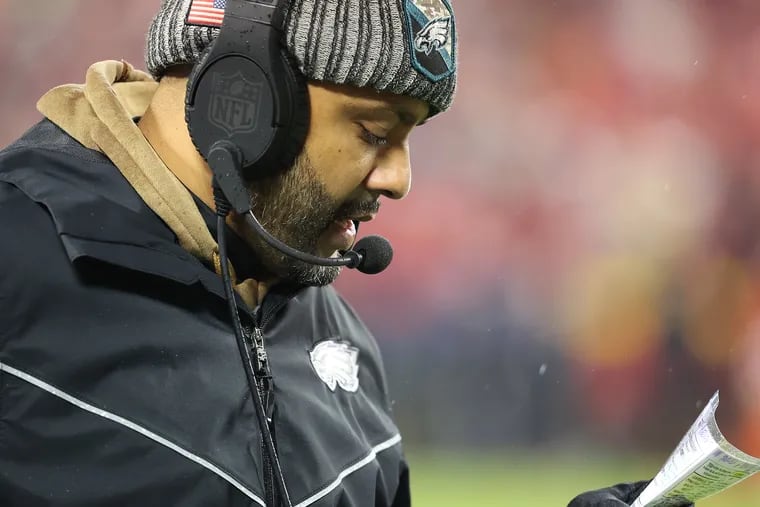 Philadelphia Eagles defensive coordinator Sean Desai looks over his chart in the Eagles 21-17 win over the Chiefs at Arrowhead Stadium in Kansas City, Mo. on Monday, Nov. 20, 2023.