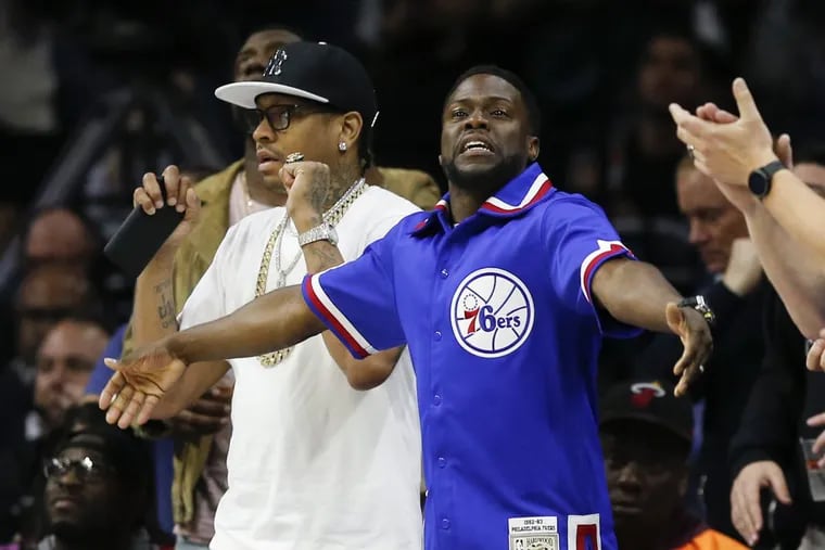Comedian Kevin Hart and former Sixers Allen Iverson cheer for the Sixers against the Miami Heat in game two of the Eastern Conference quarterfinals on Monday, April 16, 2018 in Philadelphia.