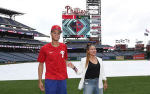 Justin Crawford poses with his father, former Major League Baseball player  Carl Crawford, befor …