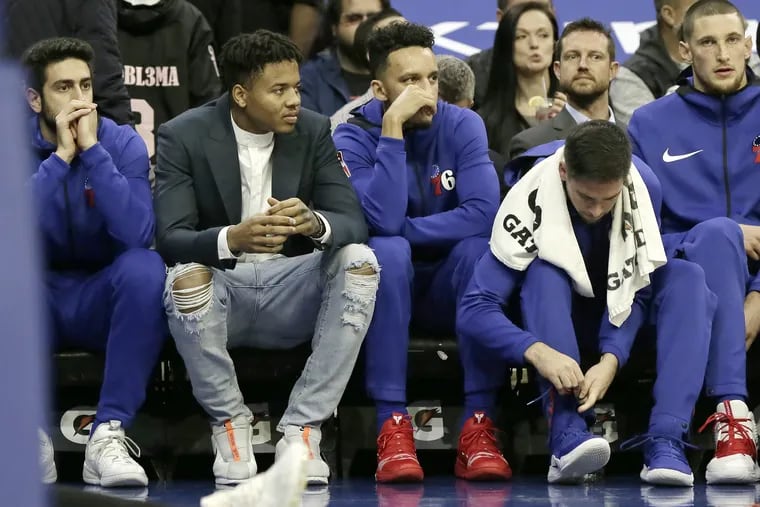 Sixers guard Markelle Fultz (ripped jeans) sits on the bench during the first quarter of Wednesday's game against New Orleans.