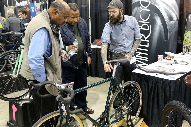 Patrons inspect a bike at the 2014 Philly Bike Expo which will be held this weekend.