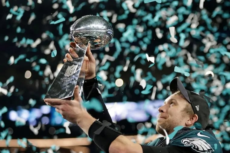 Nick Foles admires the Lombardi Trophy after he passed for 373 yards and three touchdowns in an MVP performance in Super Bowl LII.